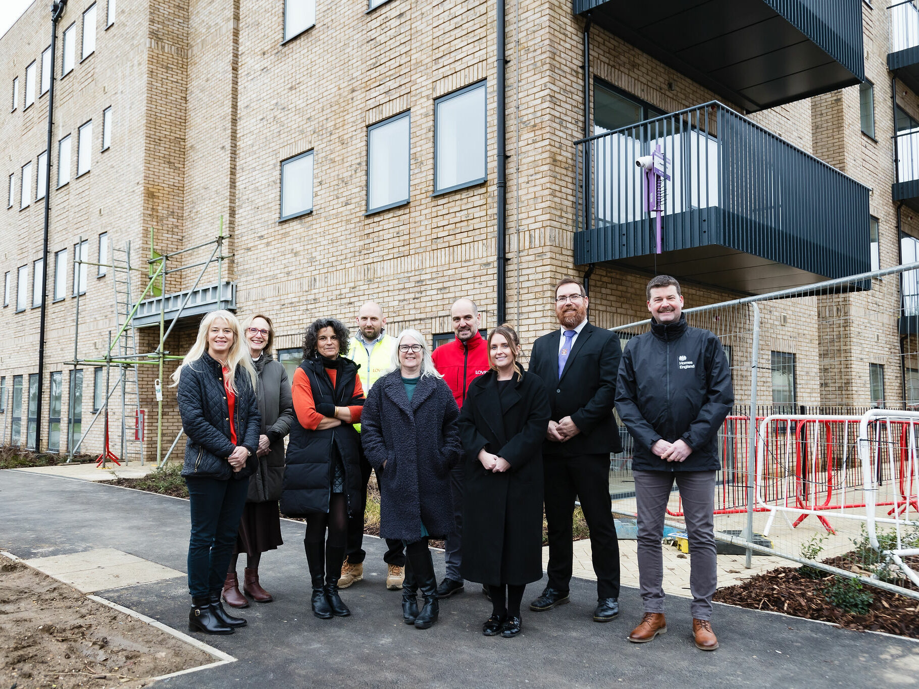 Colleagues from Settle, Cllr Daniel Allen - Leader of North Herts Council, James Hick from Homes England and our partners at Lovell celebrate completion of new homes at John Barker Place, Phase 2. 